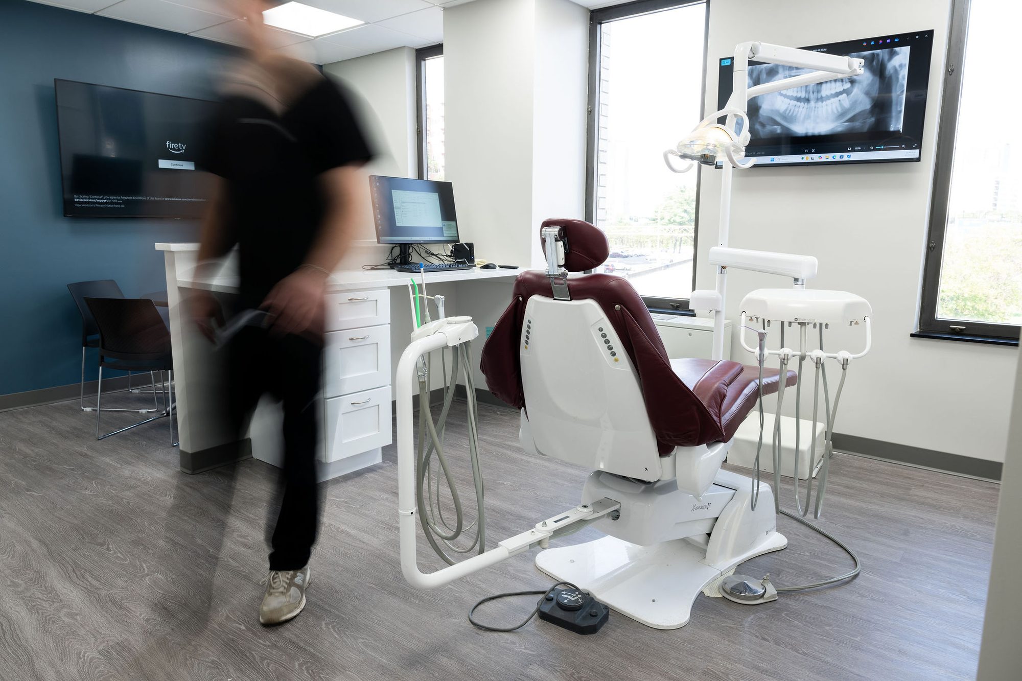Motion blur — clinical team in action at Dental Serenity